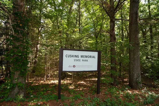 a sign on the side of the tree