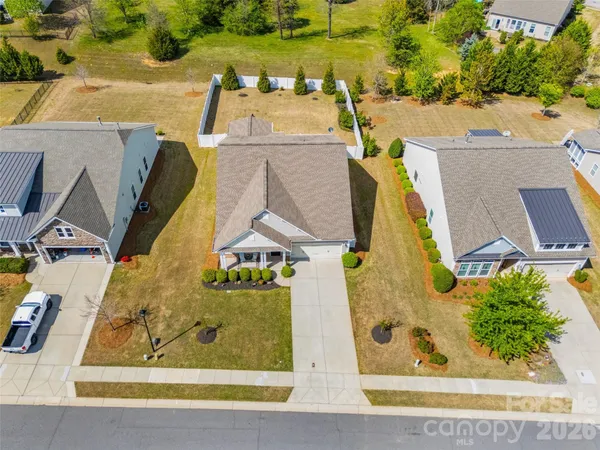 an aerial view of a house with a swimming pool