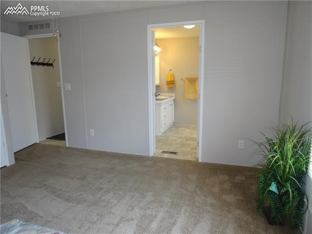 3405 Sinton Road, Unit 233 Colorado Springs, CO 80907 - Photo 13 of 22 Door to bath from master bedroom. Can also enter bathroom from hallway, for guests