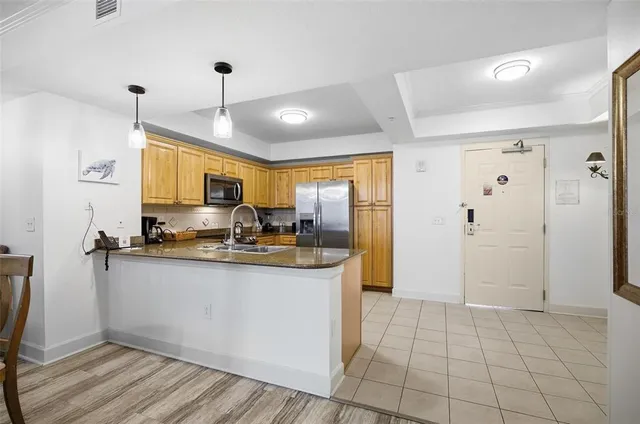 a bedroom with a large bed couch and a window