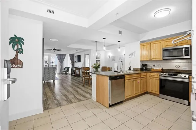 a spacious bathroom with a sink double vanity granite and a mirror