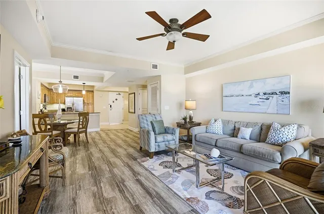 a bedroom with two beds and a chandelier