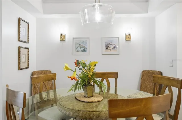 a bedroom with two beds and painting on the wall