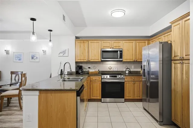 a bathroom with a sink vanity granite and a mirror