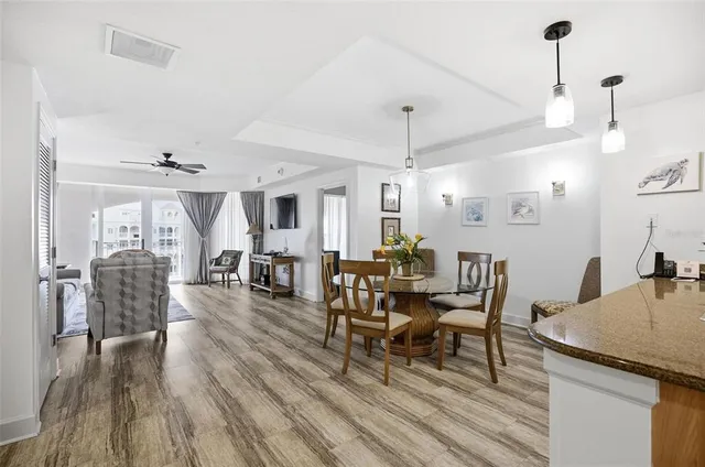 a kitchen with stainless steel appliances granite countertop a refrigerator a stove top oven a sink dishwasher and wooden cabinets