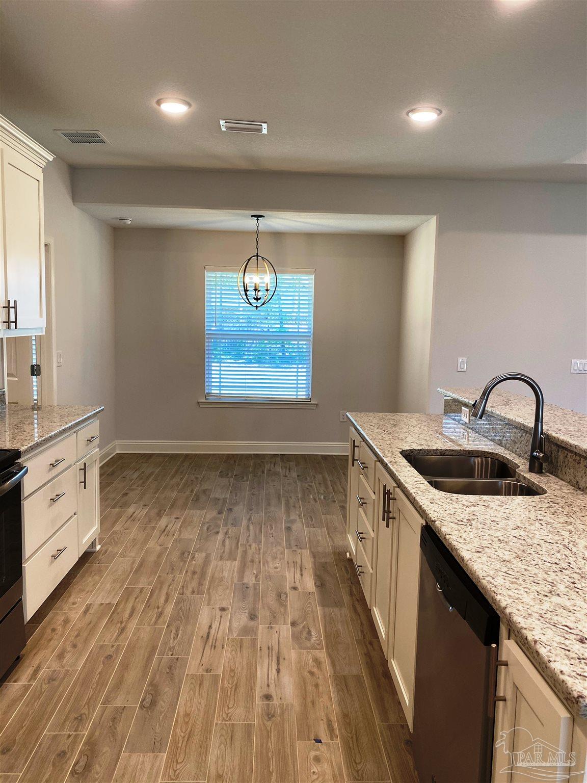 5496 South A Jones Road Milton, FL 32583 - Photo 13 of 26 A view from kitchen to nook is seen here.