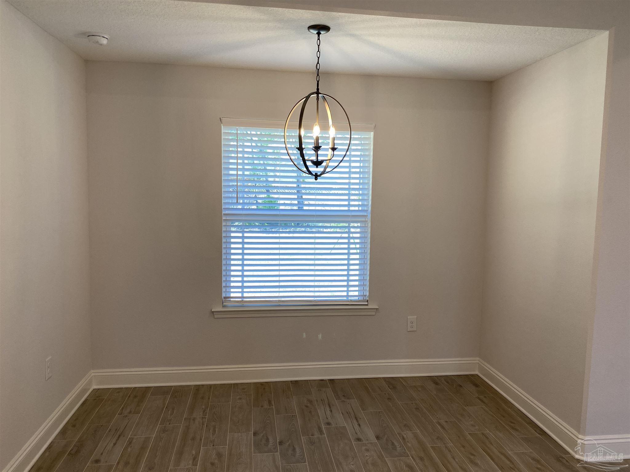 5496 South A Jones Road Milton, FL 32583 - Photo 14 of 26 The breakfast nook overlooks the backyard.