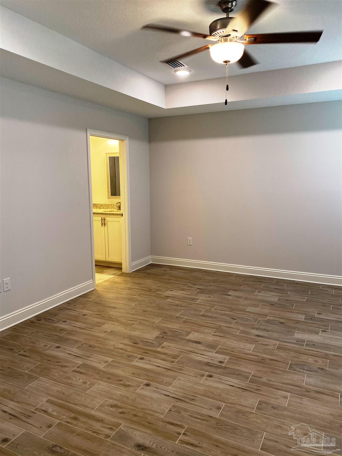 5496 South A Jones Road Milton, FL 32583 - Photo 19 of 26 The master bedroom has a box ceiling w/fan/light.