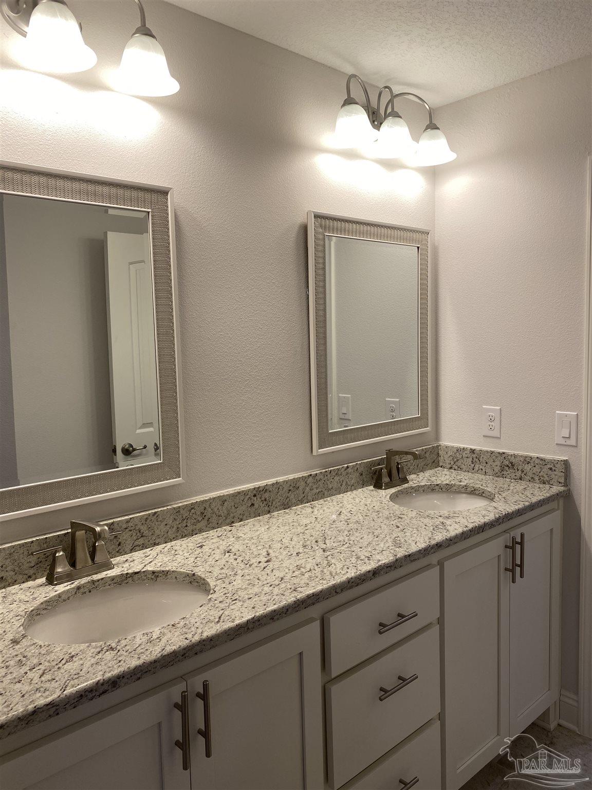 5496 South A Jones Road Milton, FL 32583 - Photo 21 of 26 Master bath has dual sink granite vanity top.