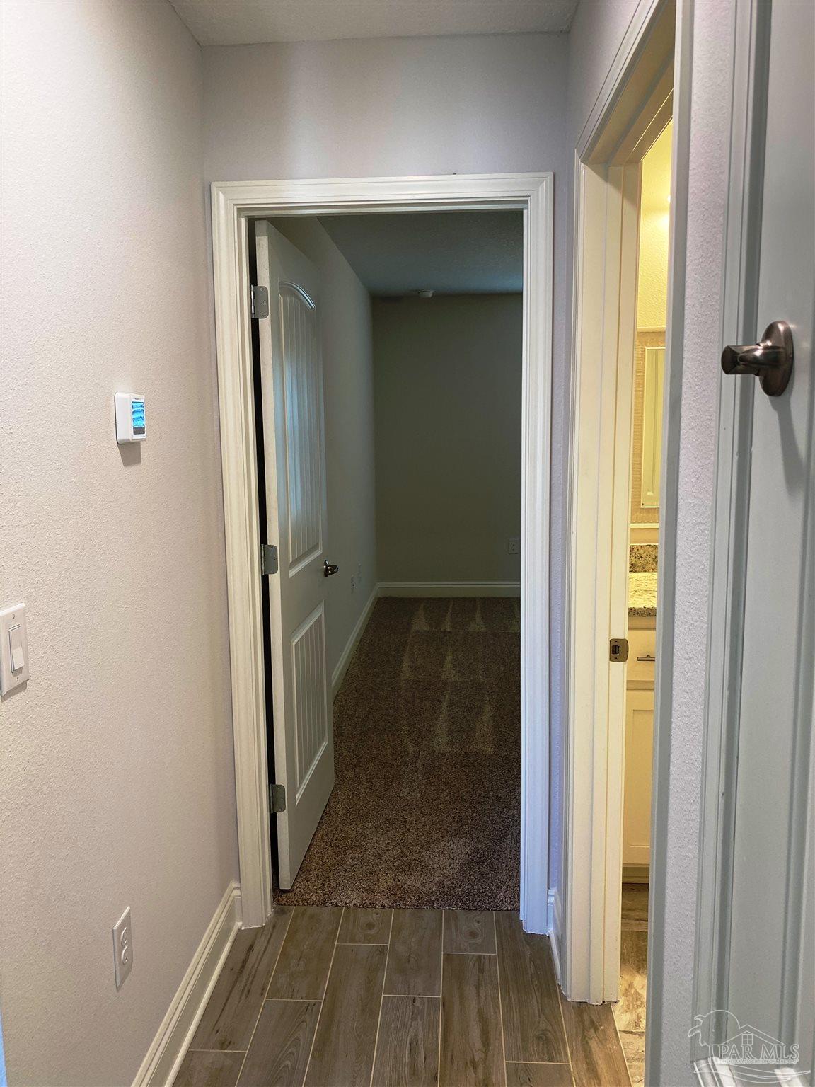 5496 South A Jones Road Milton, FL 32583 - Photo 5 of 26 Guest hall leads to 2 bedrooms & 1 bath.