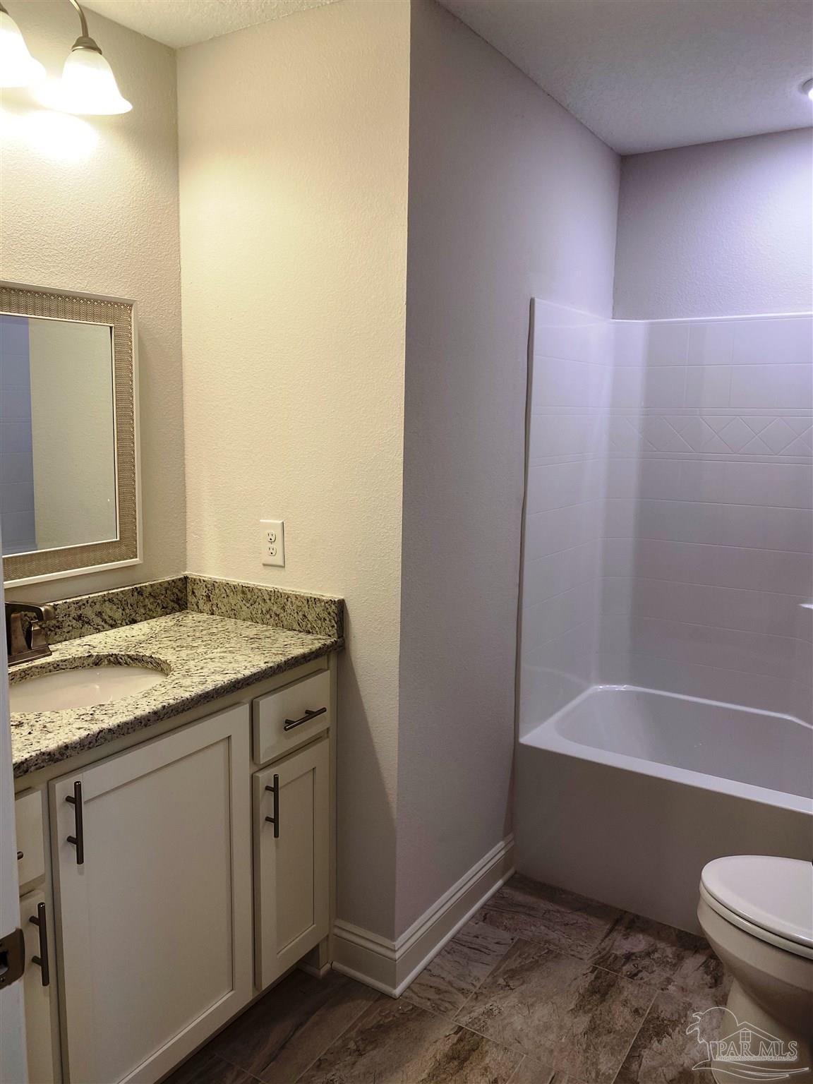 5496 South A Jones Road Milton, FL 32583 - Photo 6 of 26 The 2nd full bath has a shower/tub combination.