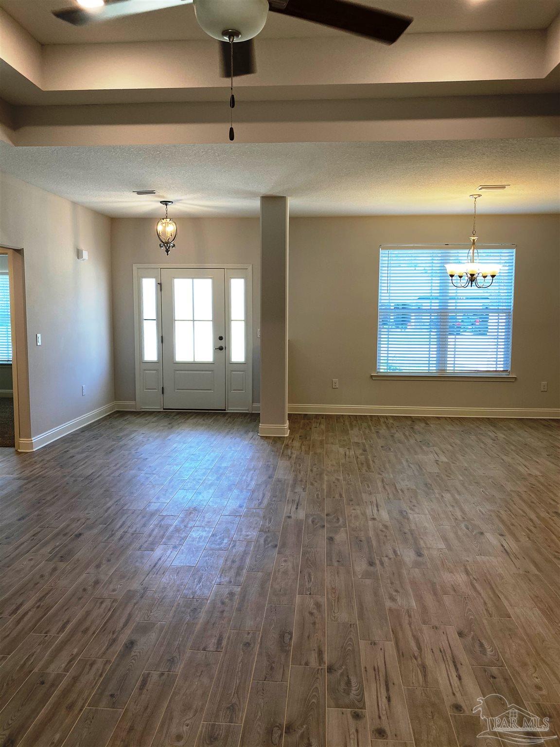 5496 South A Jones Road Milton, FL 32583 - Photo 9 of 26 Here's a view from living room to foyer/dining.