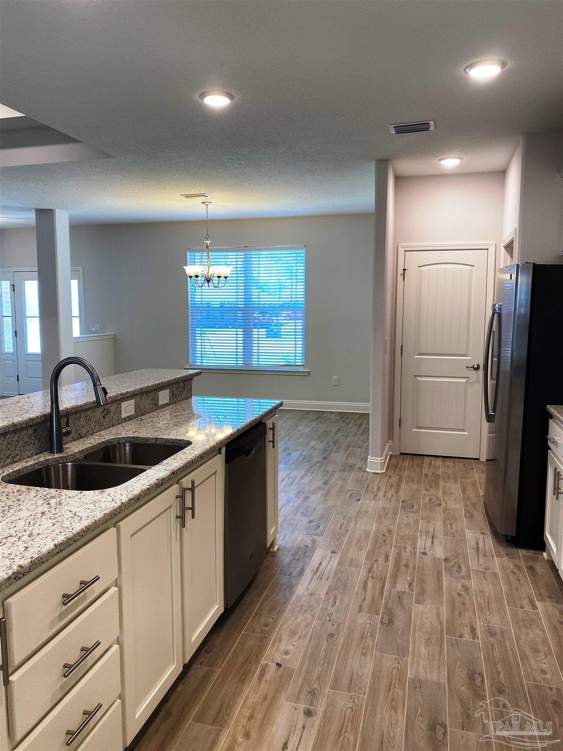 5496 South A Jones Road Milton, FL 32583 - Photo 10 of 26 Here's a view from kitchen to dining room.