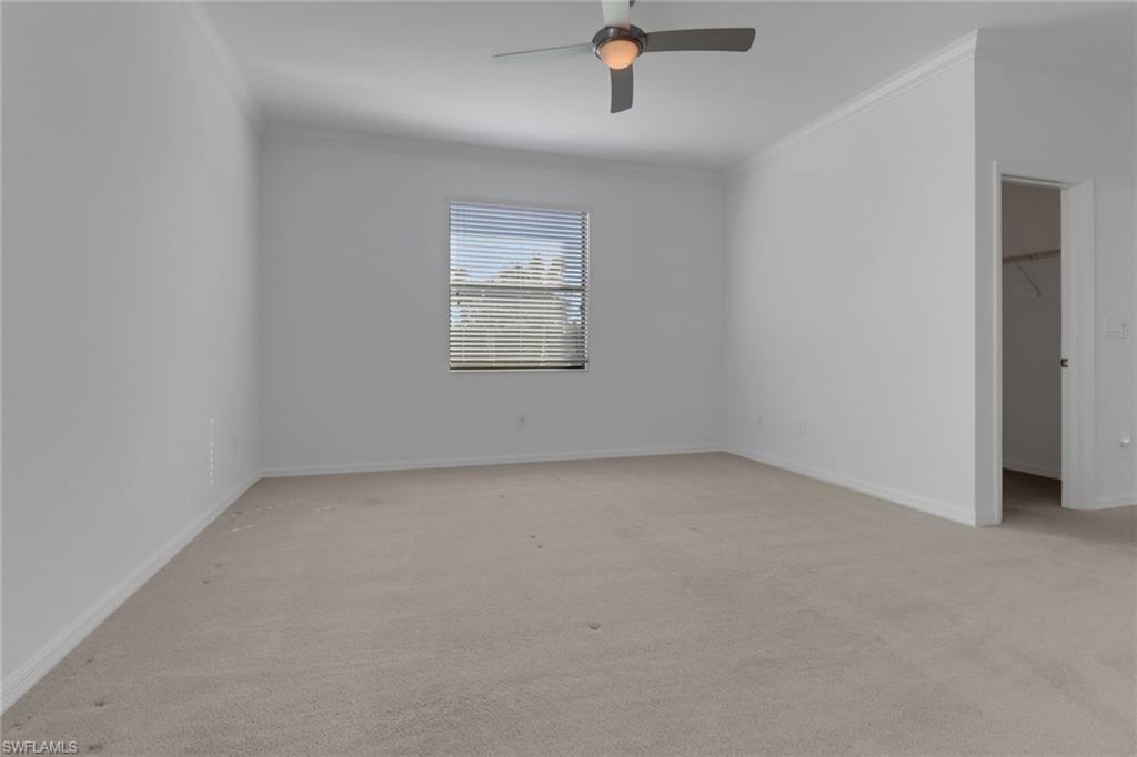 13527 San Georgio Drive Estero, FL 33928 - Photo 11 of 49 an empty room with a empty space and windows