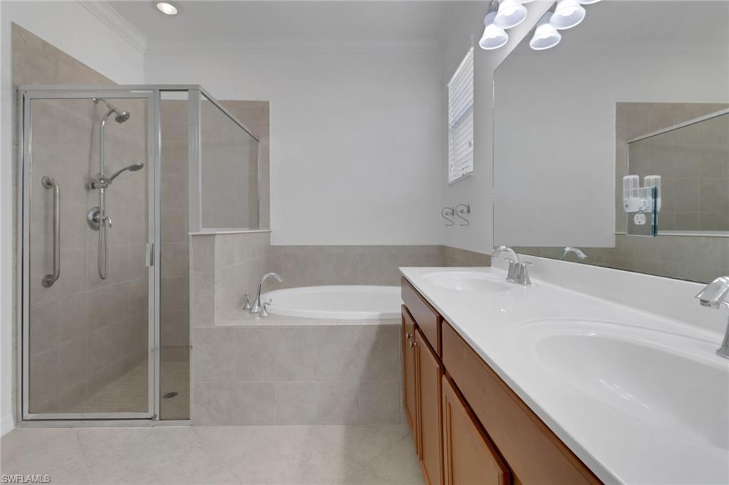 13527 San Georgio Drive Estero, FL 33928 - Photo 13 of 49 a bathroom with a sink double vanity and a shower