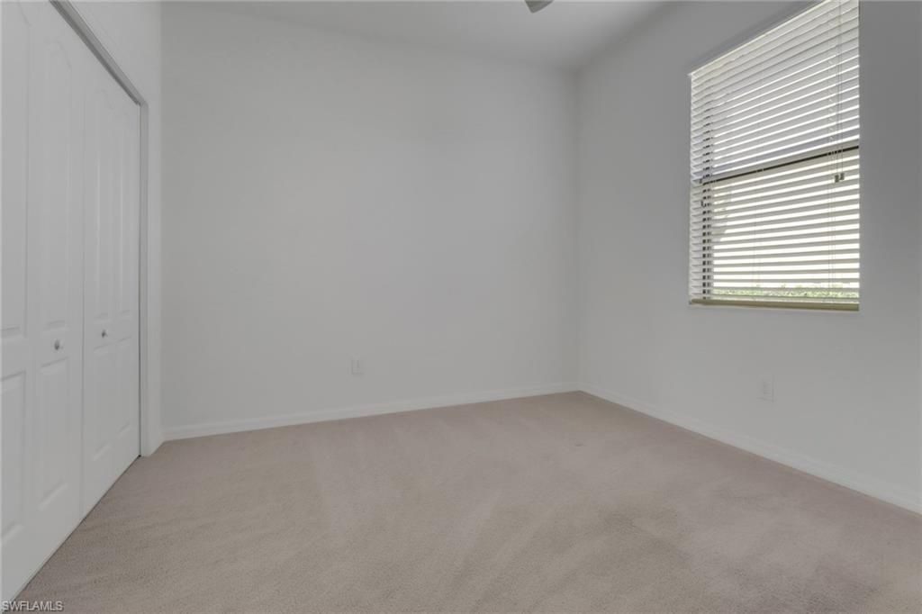 13527 San Georgio Drive Estero, FL 33928 - Photo 14 of 49 an empty room with a window