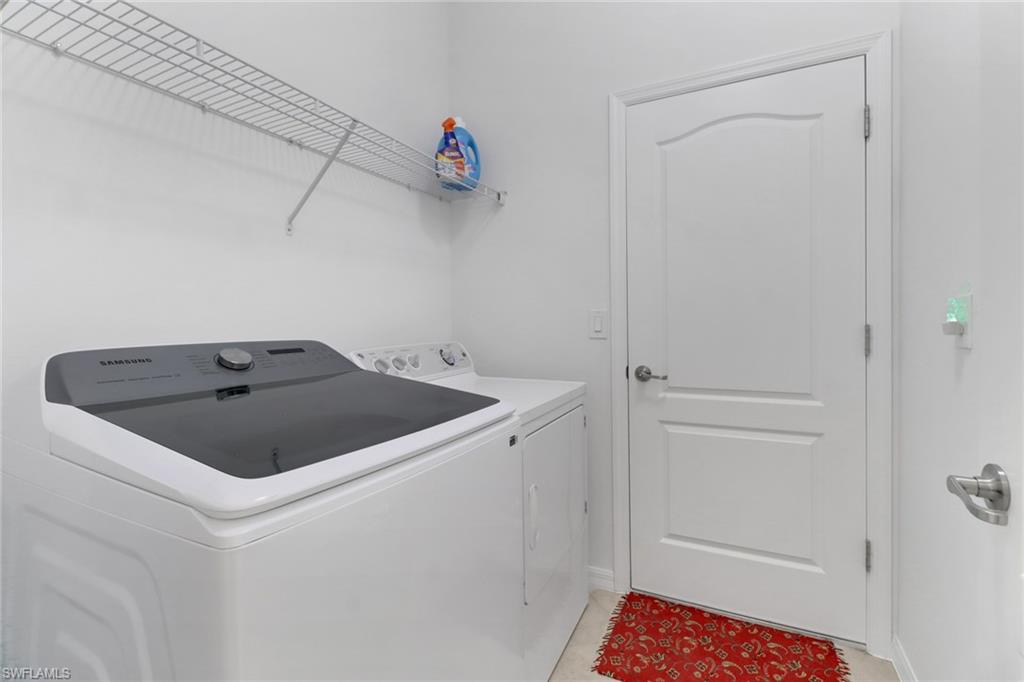 13527 San Georgio Drive Estero, FL 33928 - Photo 20 of 49 a utility room with dryer and washer