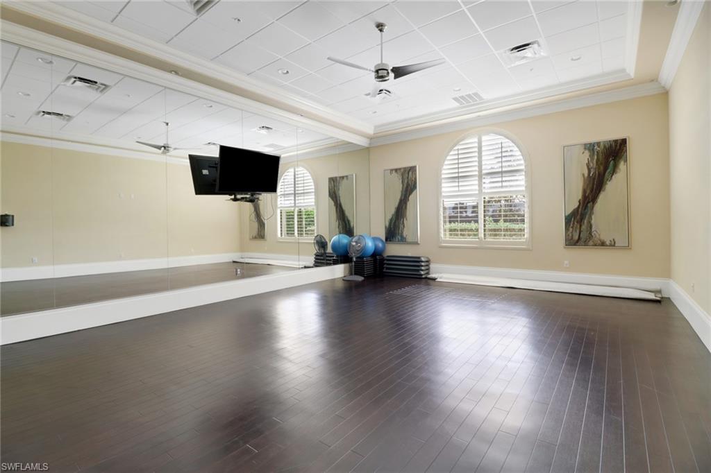 13527 San Georgio Drive Estero, FL 33928 - Photo 34 of 49 an empty room with wooden floor and windows