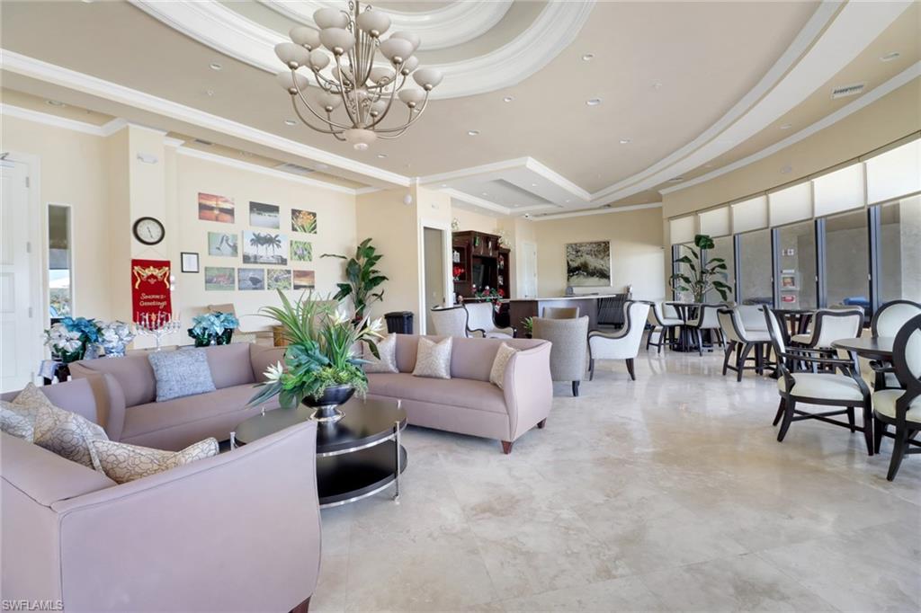 13527 San Georgio Drive Estero, FL 33928 - Photo 36 of 49 a living room with furniture dining area and a chandelier