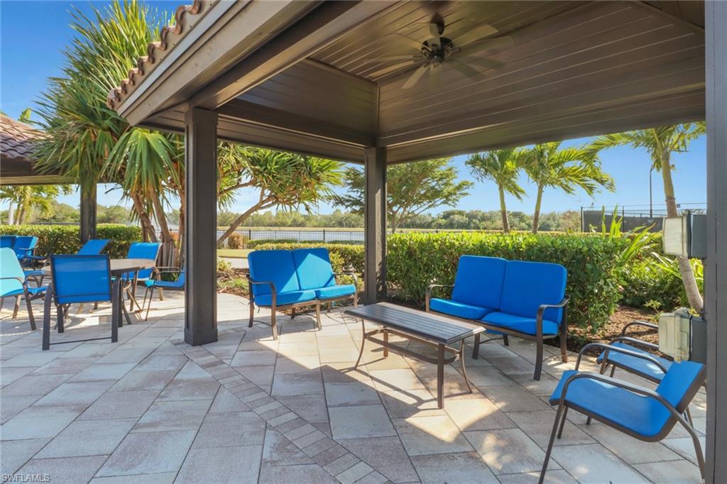 13527 San Georgio Drive Estero, FL 33928 - Photo 42 of 49 a building outdoor space with patio furniture and a potted plant