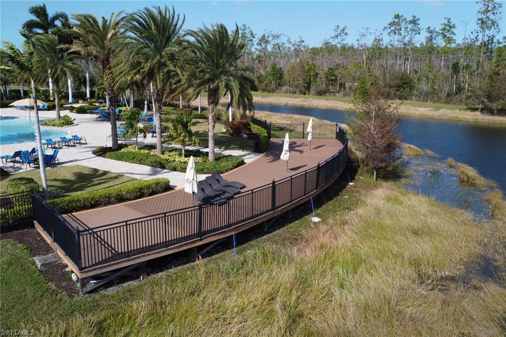 13527 San Georgio Drive Estero, FL 33928 - Photo 49 of 49 a view of a yard with wooden fence