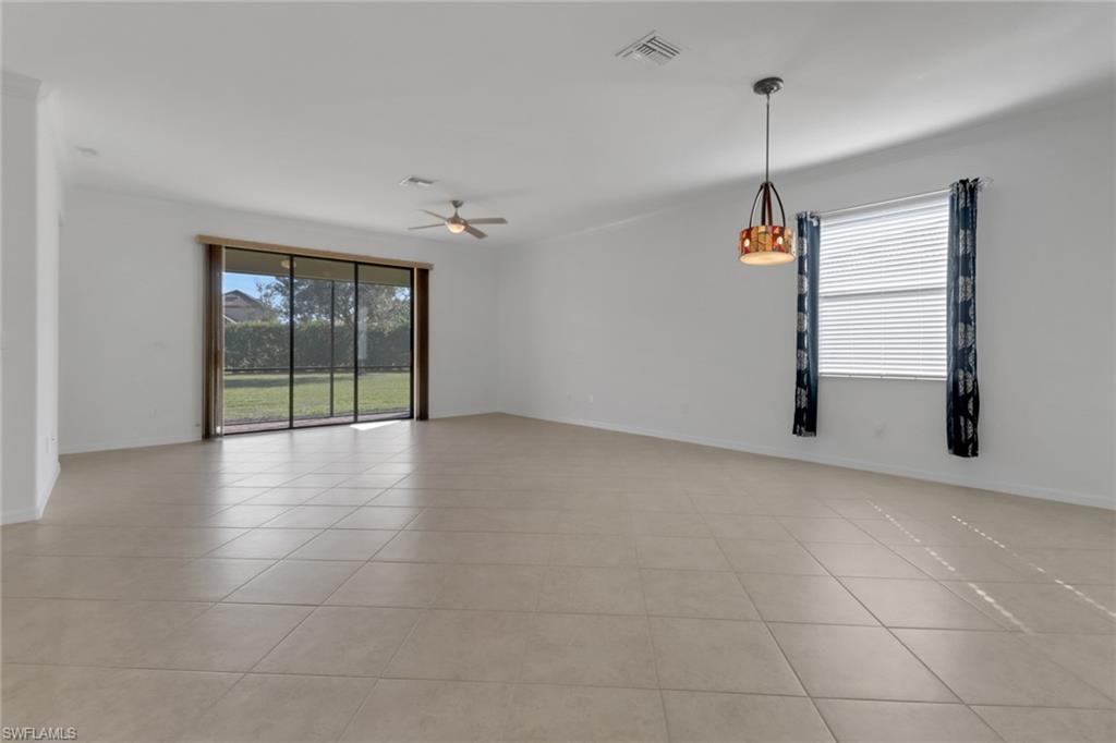 13527 San Georgio Drive Estero, FL 33928 - Photo 5 of 49 a view of an empty room with a window