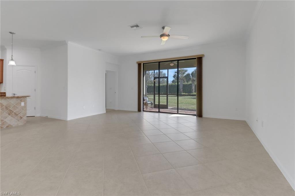 13527 San Georgio Drive Estero, FL 33928 - Photo 7 of 49 an empty room with windows
