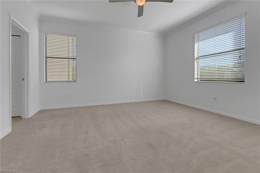 13527 San Georgio Drive Estero, FL 33928 - Photo 10 of 49 an empty room with a window