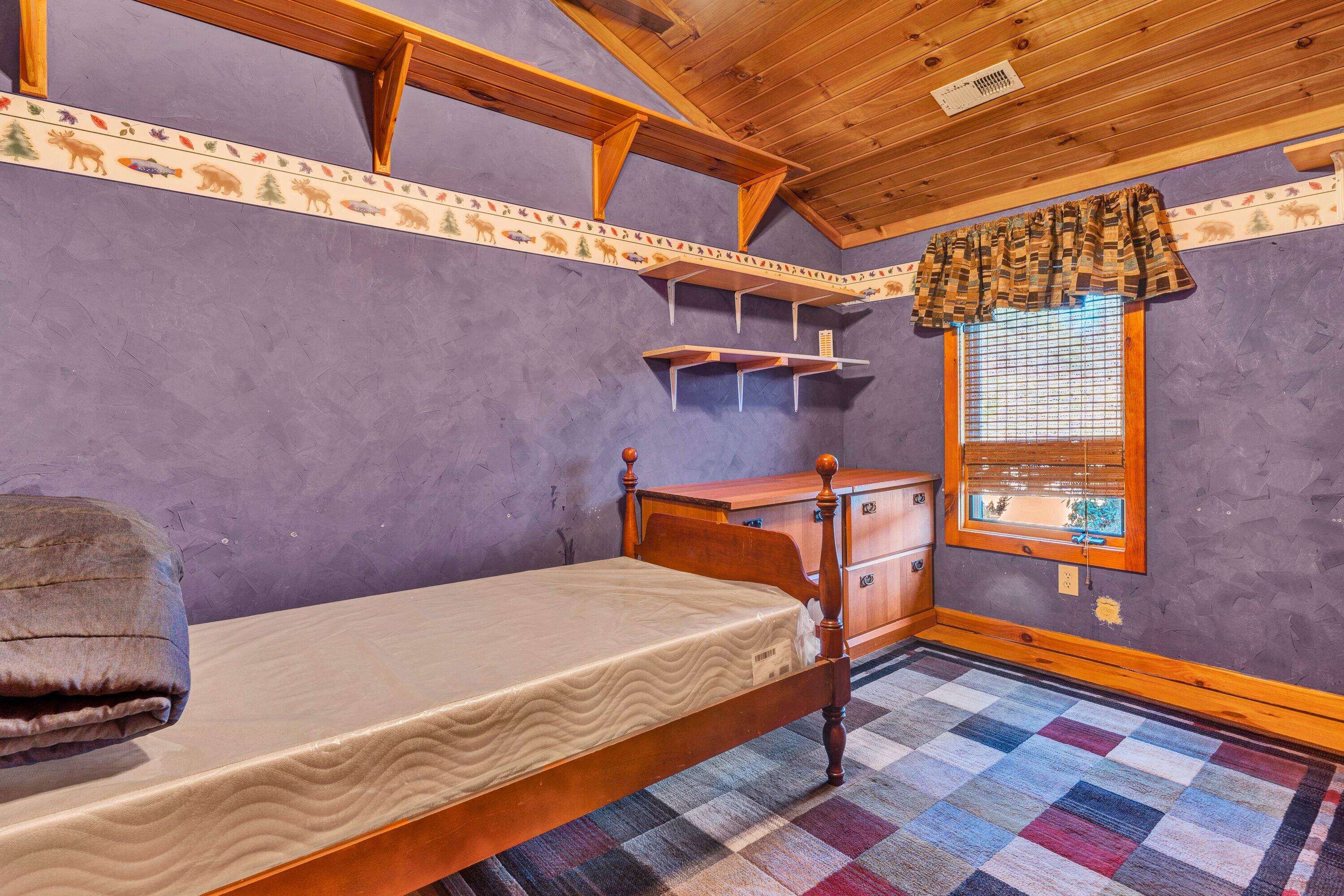 765 Algoma Road Callaway, VA 24067 - Photo 31 of 61 a bedroom with a bed and wooden floor