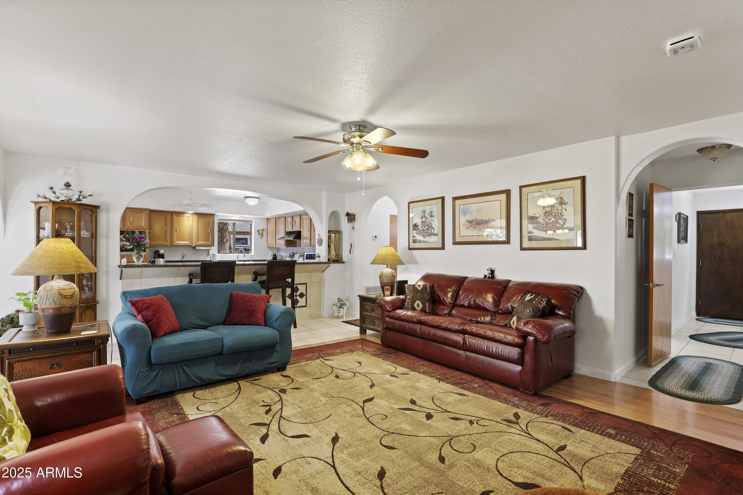 1418 North Sunset Drive Payson, AZ 85541 - Photo 15 of 48 a living room with furniture ceiling fan and a rug