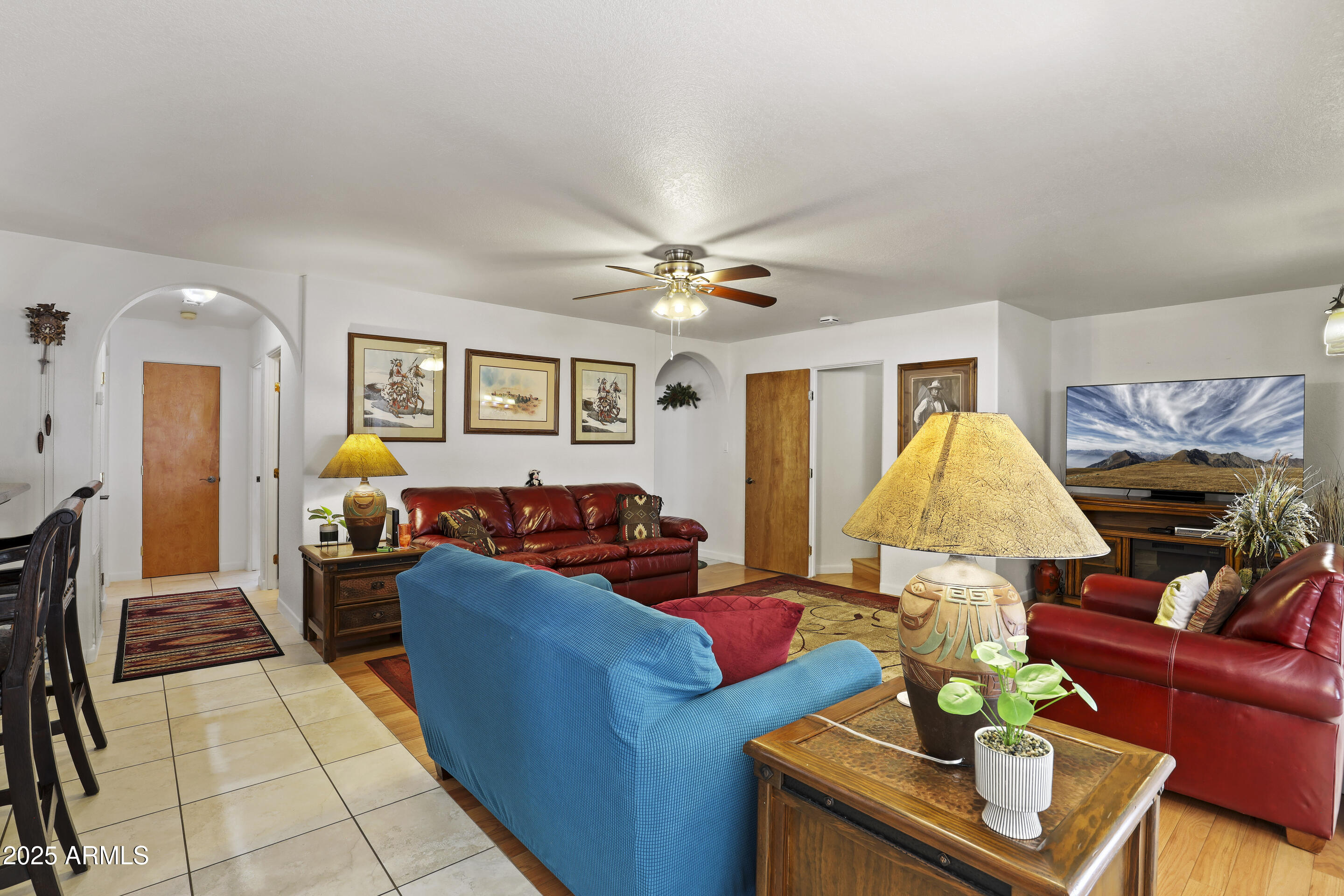 1418 North Sunset Drive Payson, AZ 85541 - Photo 17 of 48 a living room with furniture and a chandelier