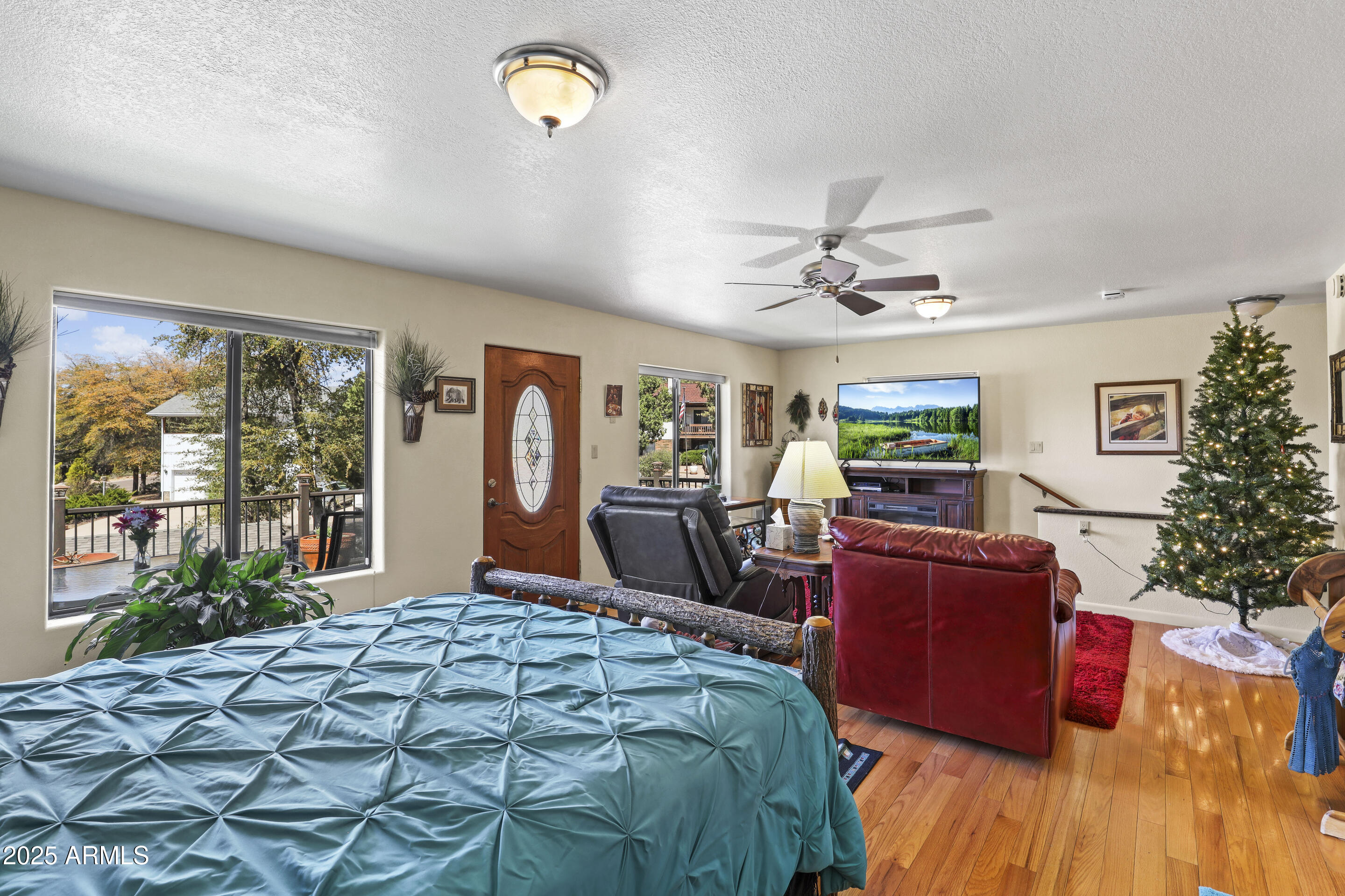 1418 North Sunset Drive Payson, AZ 85541 - Photo 19 of 48 a bedroom with a bed dresser and a large window