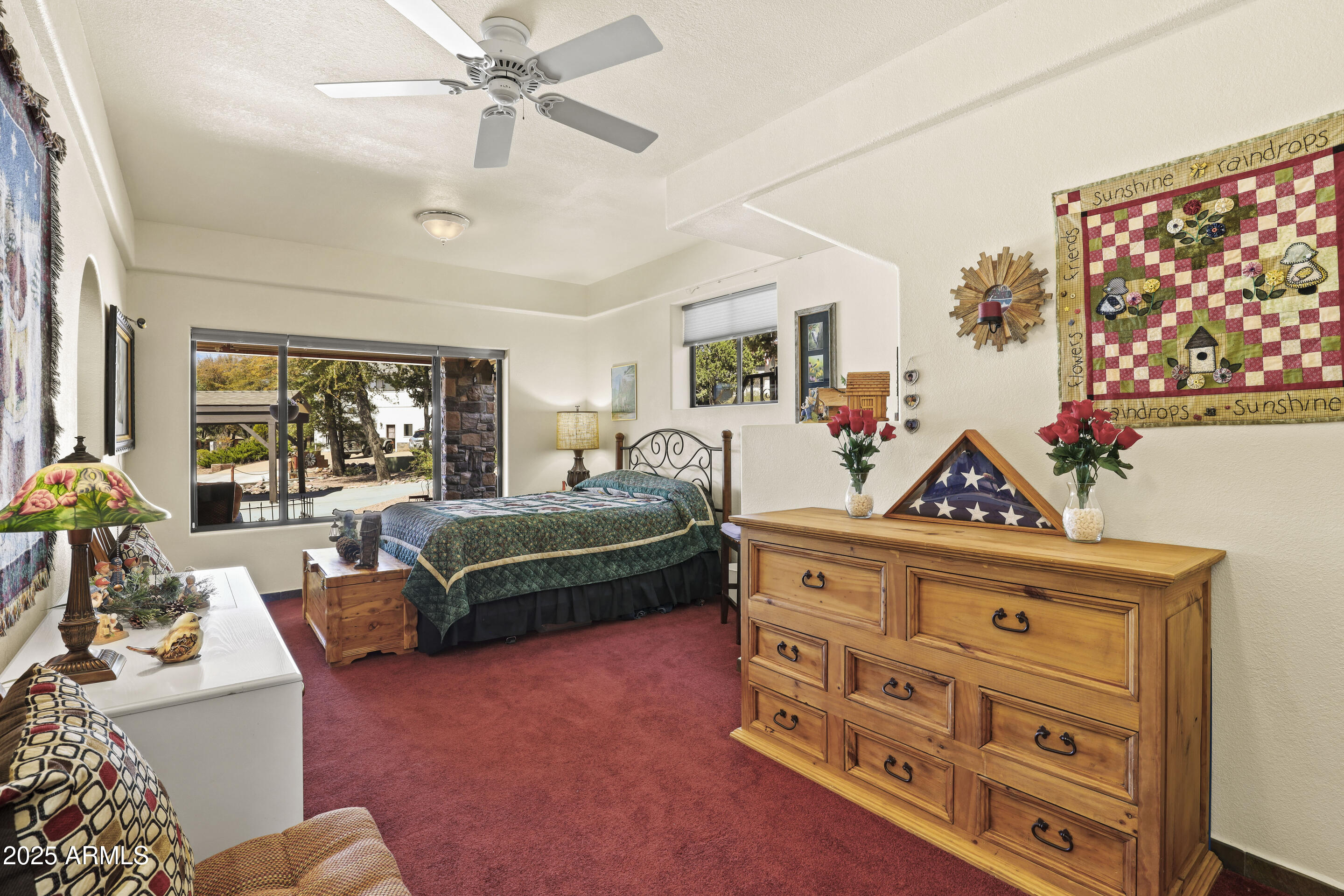 1418 North Sunset Drive Payson, AZ 85541 - Photo 37 of 48 a bedroom with furniture and a chandelier