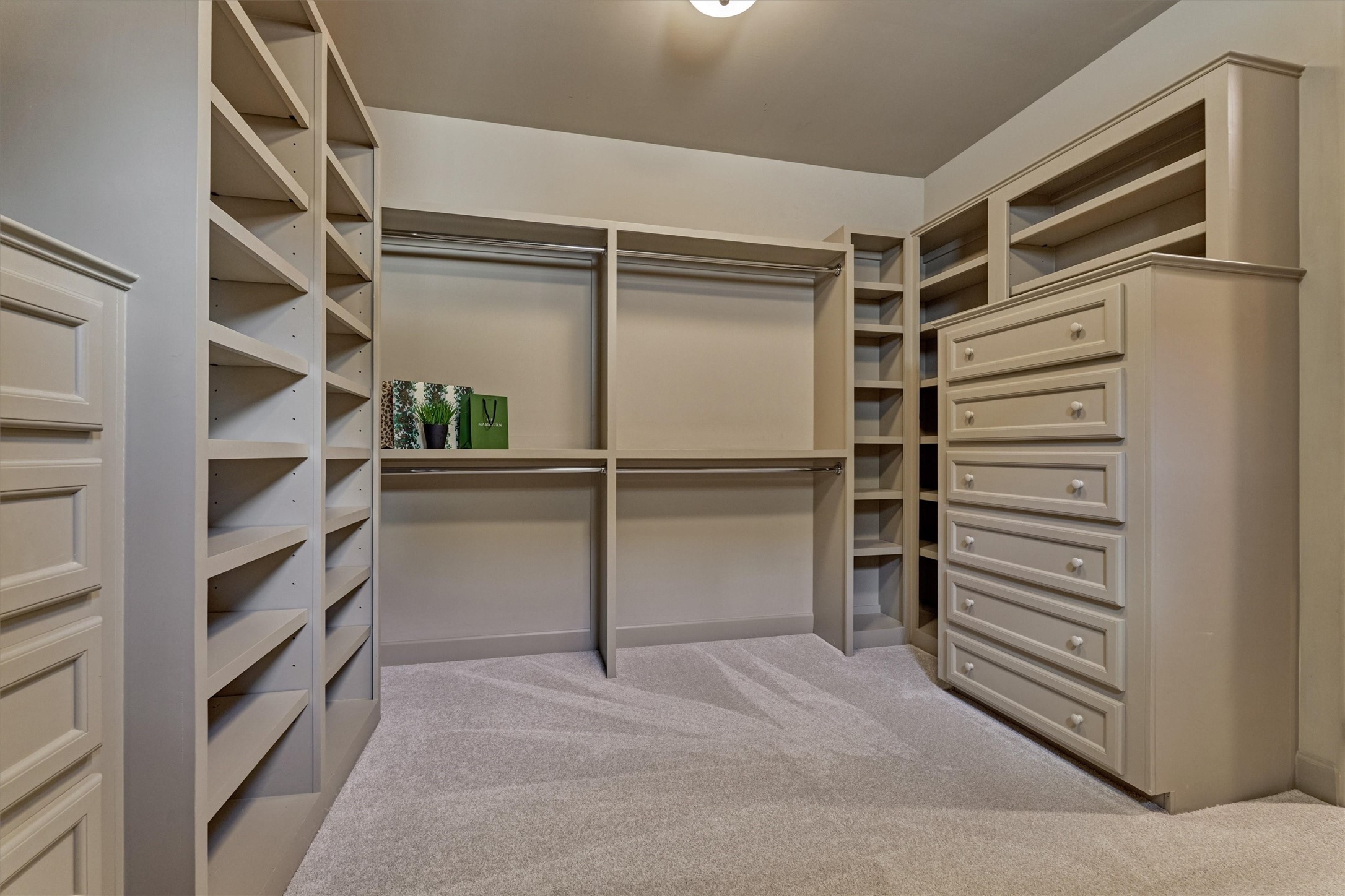 7 Dorset Square The Woodlands, TX 77381 - Photo 23 of 50 View 2, large custom walk-in closet with built-in dressers and shelving. 2026 Carpet.