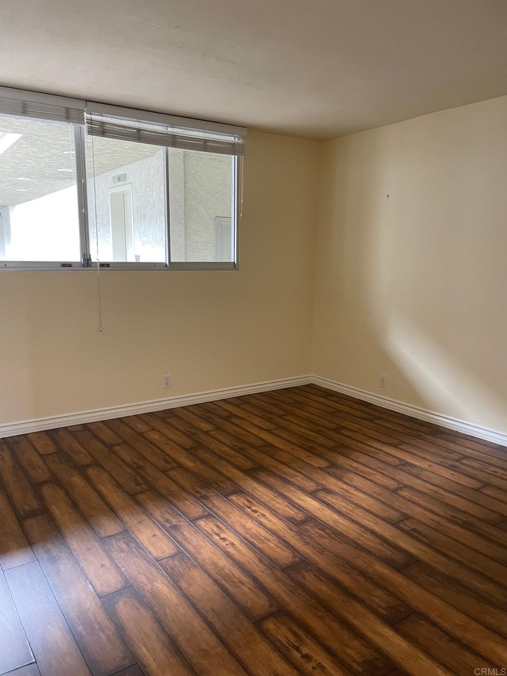 7811 Eads Avenue, Unit 307 La Jolla, CA 92037 - Photo 9 of 17 a view of empty room with wooden floor and fan