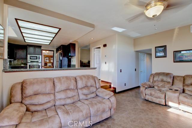 2700 Amber Circle Corona, CA 92882 - Photo 12 of 35 a living room with furniture and a flat screen tv