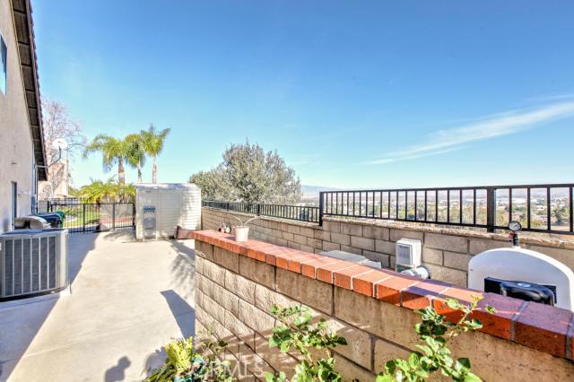 2700 Amber Circle Corona, CA 92882 - Photo 16 of 35 a balcony with table and chairs