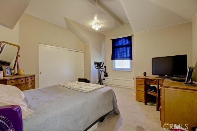 2700 Amber Circle Corona, CA 92882 - Photo 26 of 35 a bedroom with a bed and a flat screen tv