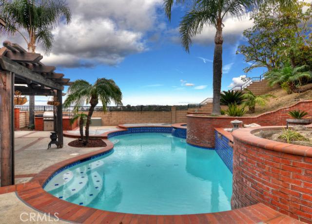 2700 Amber Circle Corona, CA 92882 - Photo 3 of 35 a view of a swimming pool with an outdoor seating
