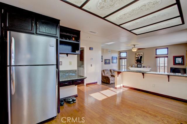 2700 Amber Circle Corona, CA 92882 - Photo 10 of 35 a kitchen with stainless steel appliances kitchen island granite countertop a refrigerator and a stove top oven