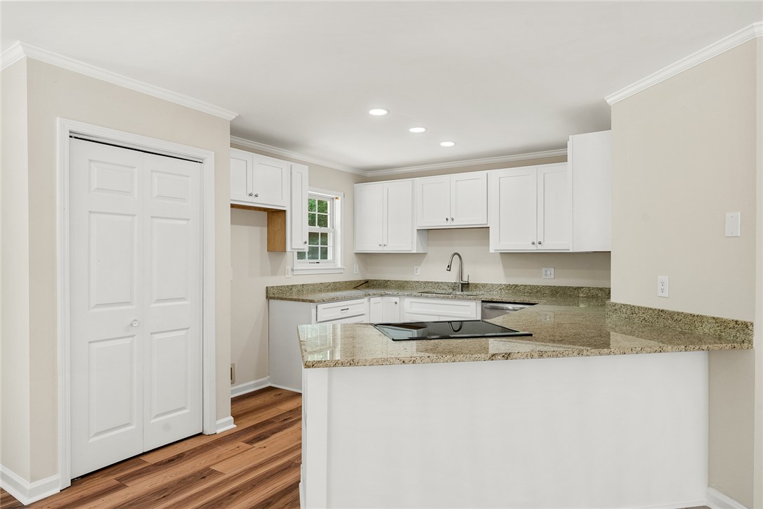 131 Lockaby Road Pelzer, SC 29669 - Photo 3 of 50 Bright and inviting kitchen with ample counter space, perfect for culinary endeavors and casual dining.