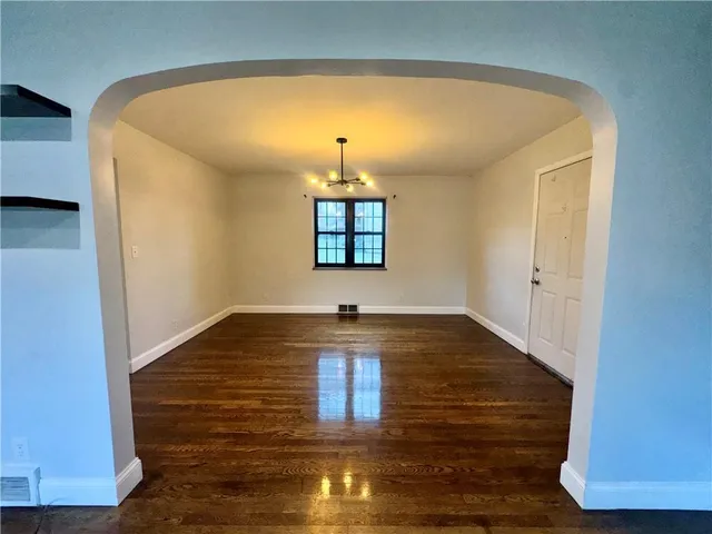 a view of livingroom with hardwood floor and hallway