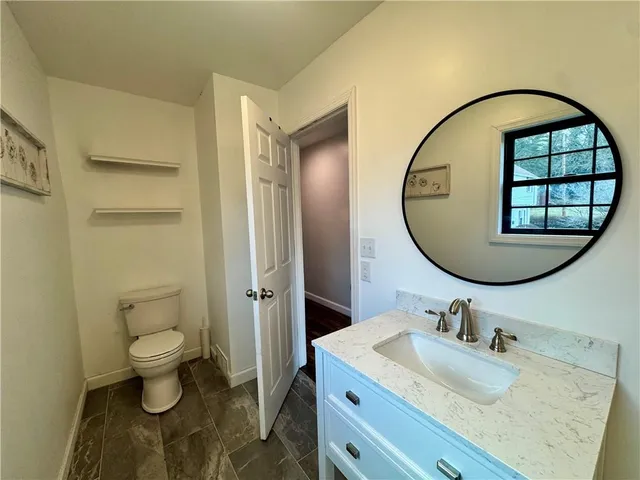 a view of a livingroom with a staircase