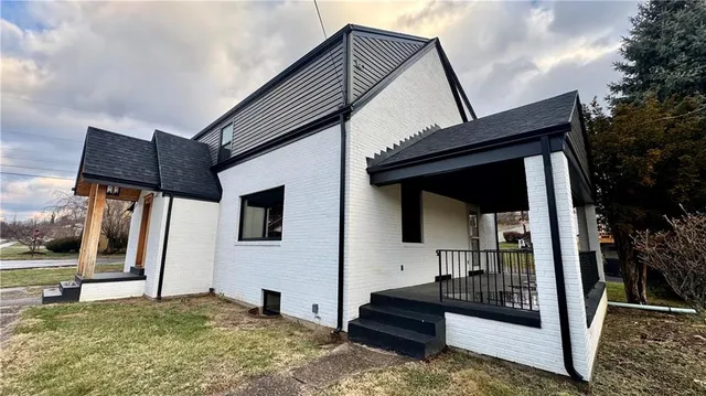 a large kitchen with granite countertop a large stove a sink and dishwasher