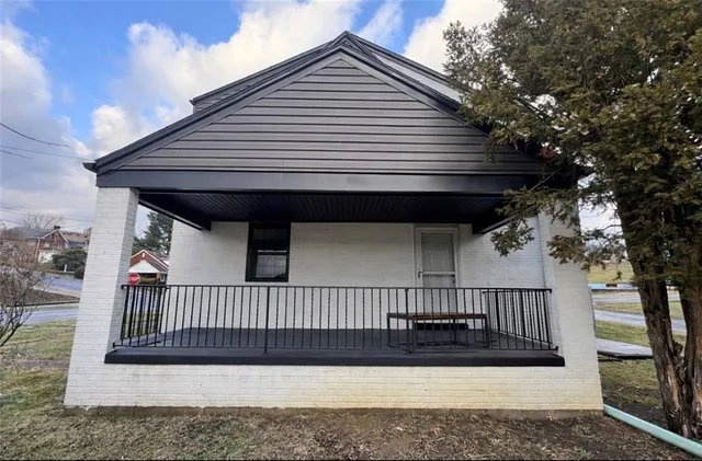 a kitchen with granite countertop a stove sink and refrigerator