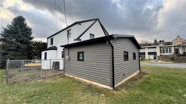 a kitchen with a stove a sink and a refrigerator