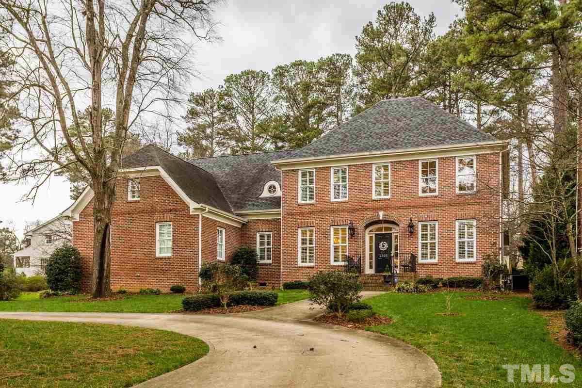 2305 Coley Forest Place Raleigh, NC 27612 - Photo 1 of 24 a front view of a house with a yard