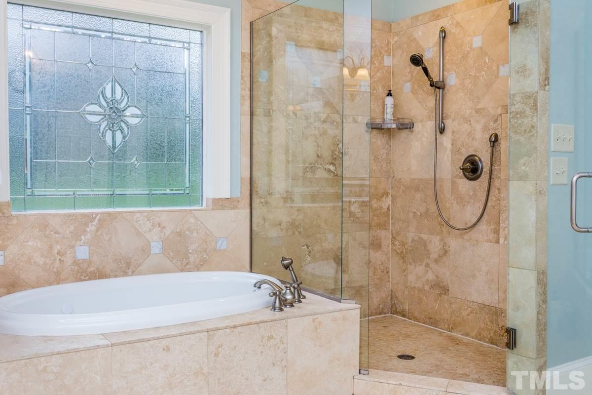2305 Coley Forest Place Raleigh, NC 27612 - Photo 14 of 24 a bathroom with a shower