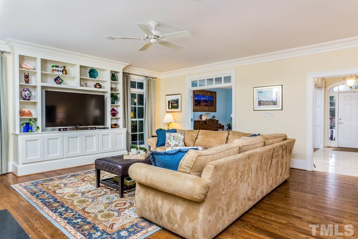 2305 Coley Forest Place Raleigh, NC 27612 - Photo 9 of 24 a living room with furniture and a flat screen tv