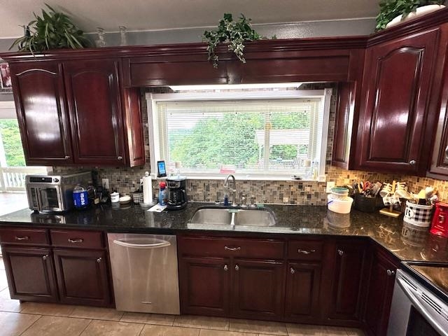 3123 Jeter Road Clifton, TN 38425 - Photo 11 of 40 a kitchen with stainless steel appliances granite countertop wooden cabinets and a granite counter tops
